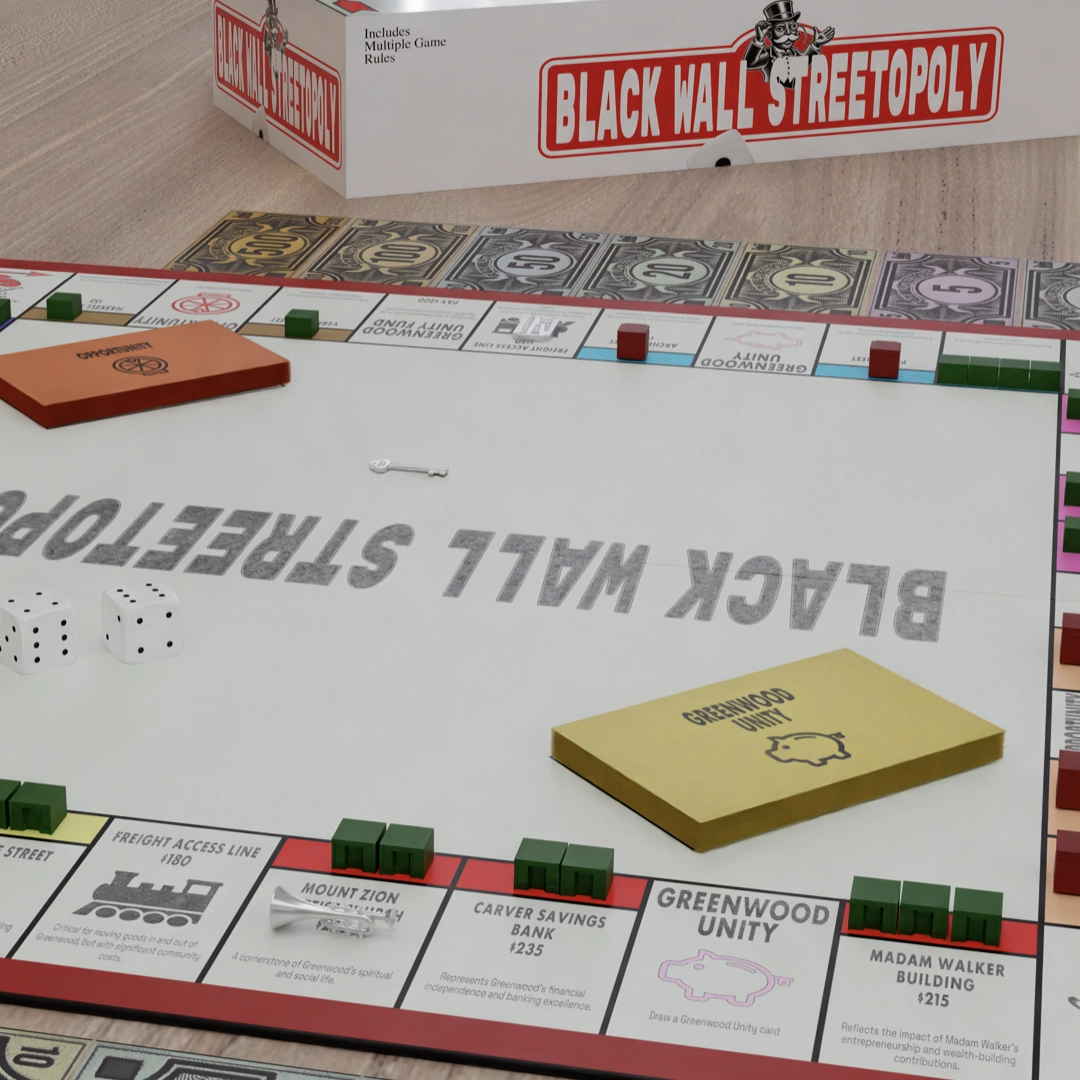 Black Wall Streetopoly board game showing Greenwood District properties and card decks